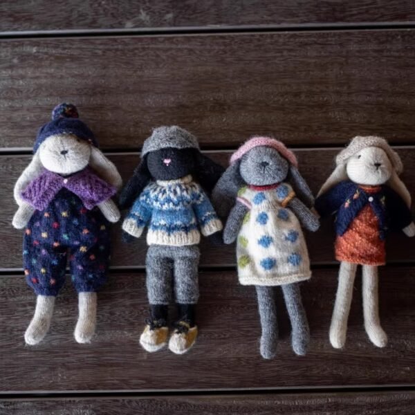 Hand-knitted different colored bunnies