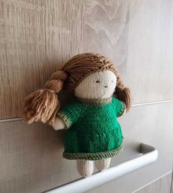 Hand knitted doll with brown hair